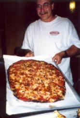 Albert with a Sally's Apizza